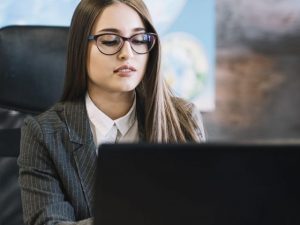 business-woman-using-laptop-table